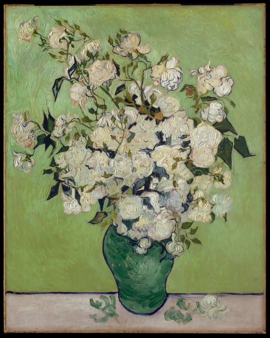 A still life of white roses in a green vase.