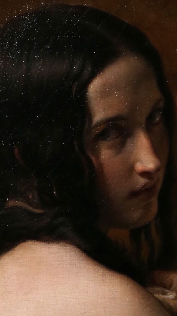 A dark portrait of a young woman with a steady, level gaze.